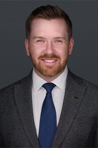 headshot of Jake McGuire